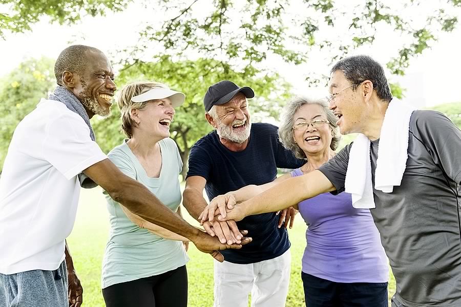 Multi-ethnic group playing at the park