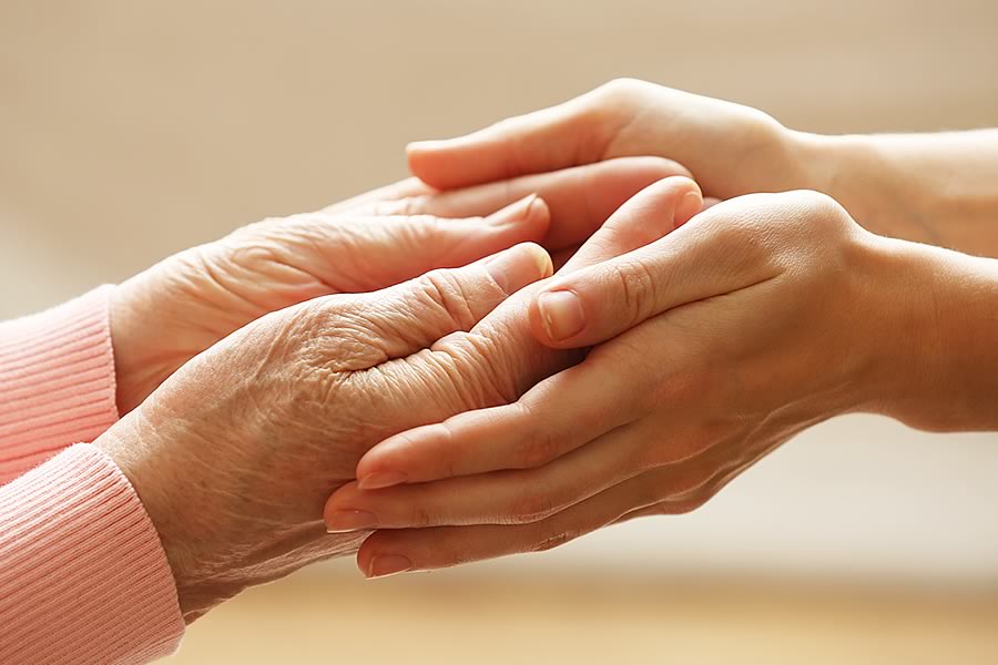 young and old hands at Donna Furey elder care attorney